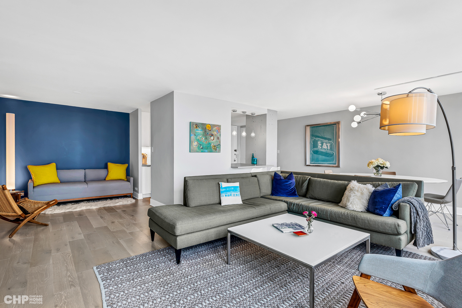 111 East Chestnut Street, Unit 49H Chicago, IL 60611 - Photo 10 of 27 a living room with furniture and a rug