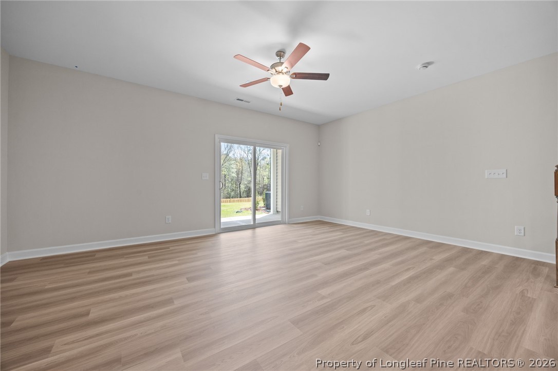 232 Elijah Way, Unit 8 Vass, NC 28394 - Photo 14 of 41 wooden floor in an empty room with a window