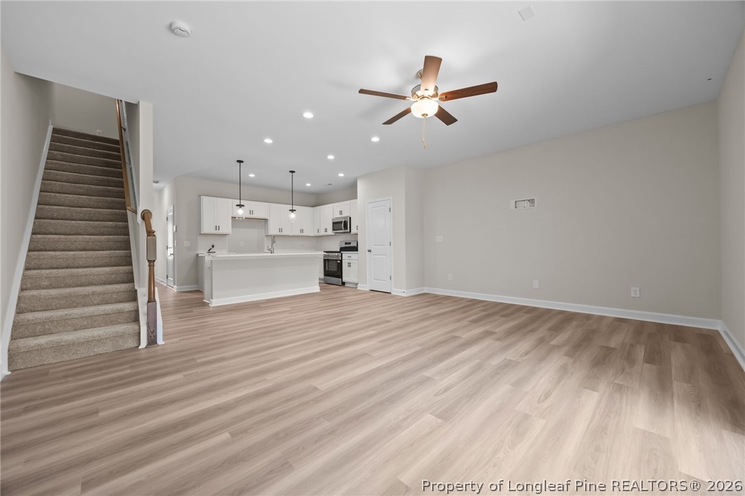 232 Elijah Way, Unit 8 Vass, NC 28394 - Photo 16 of 41 a view of a kitchen and empty room
