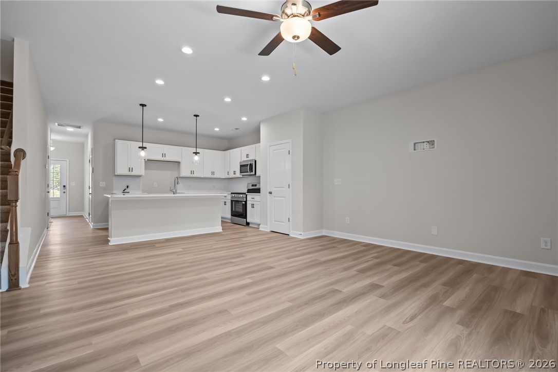 232 Elijah Way, Unit 8 Vass, NC 28394 - Photo 17 of 41 a view of a kitchen with a sink and a window