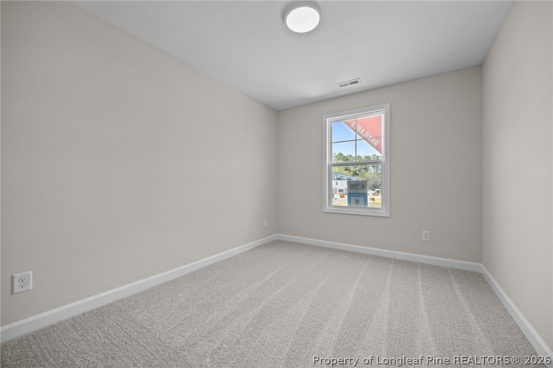 232 Elijah Way, Unit 8 Vass, NC 28394 - Photo 19 of 41 an empty room with windows