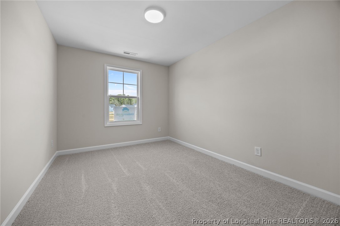 232 Elijah Way, Unit 8 Vass, NC 28394 - Photo 21 of 41 an empty room with a window