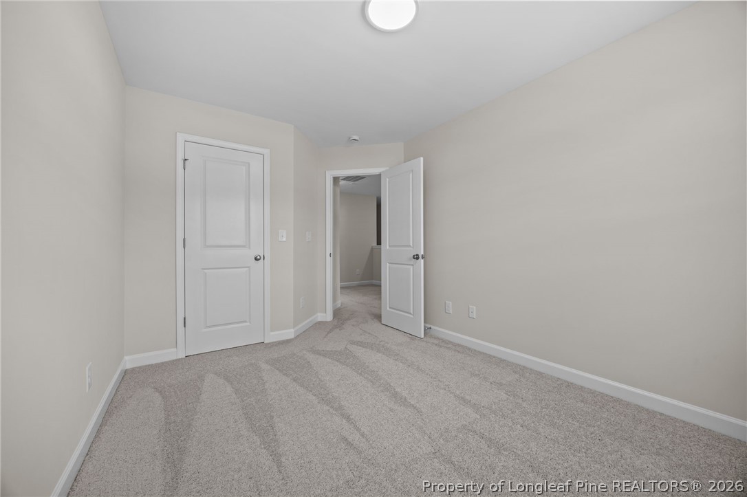 232 Elijah Way, Unit 8 Vass, NC 28394 - Photo 22 of 41 a view of an empty room