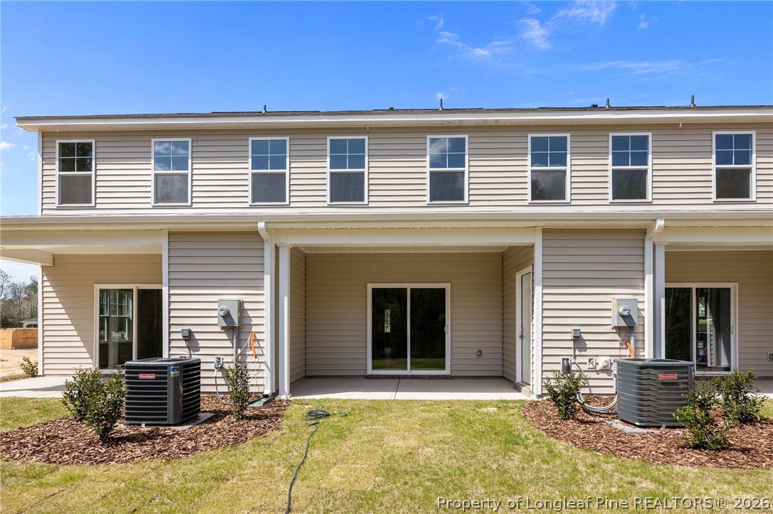 232 Elijah Way, Unit 8 Vass, NC 28394 - Photo 31 of 41 a front view of a house with a yard
