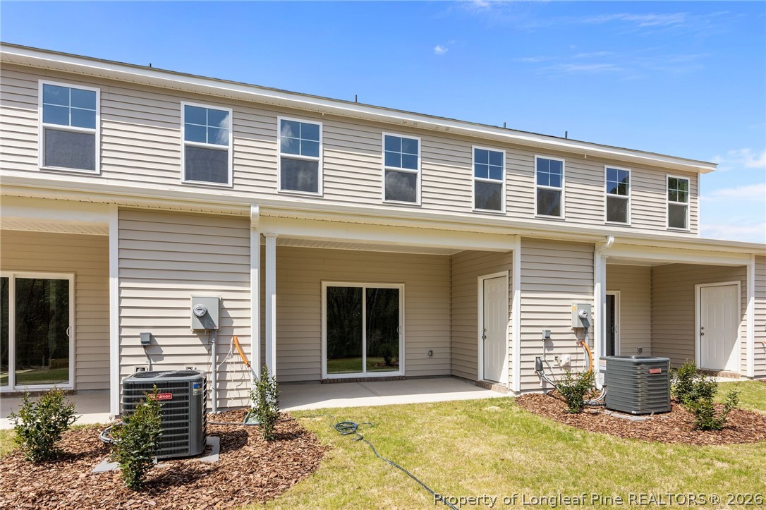 232 Elijah Way, Unit 8 Vass, NC 28394 - Photo 32 of 41 a front view of a house with a yard