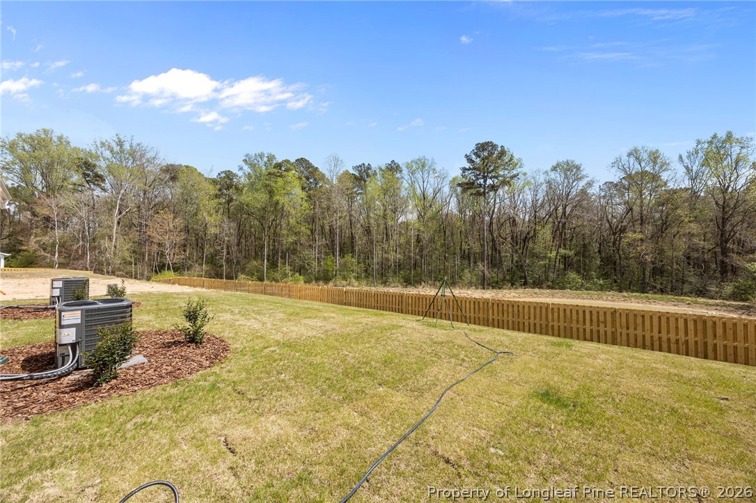 232 Elijah Way, Unit 8 Vass, NC 28394 - Photo 37 of 41 a view of a swimming pool with a yard
