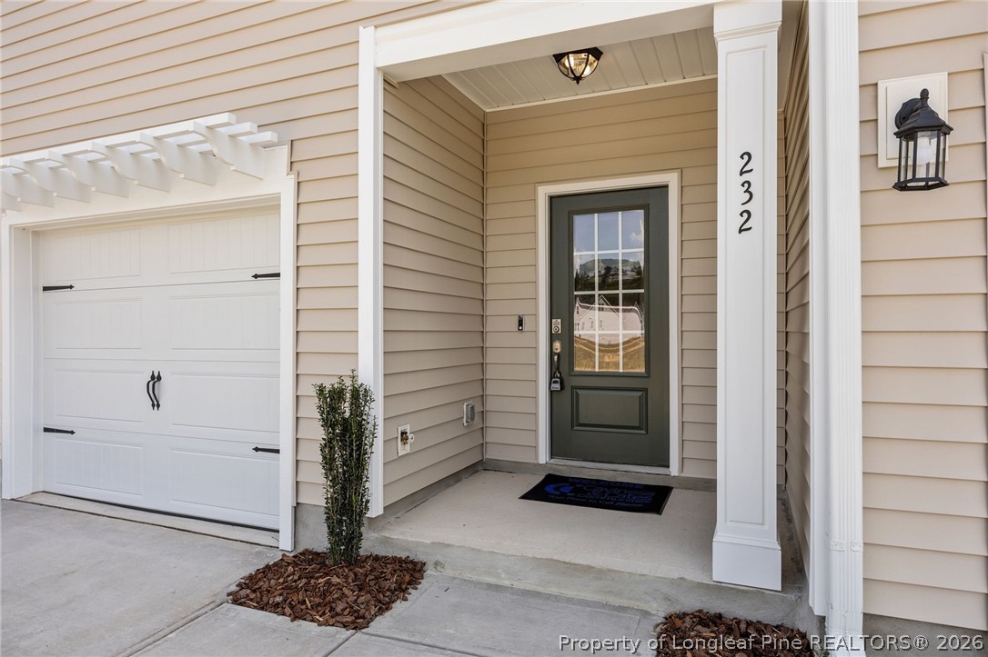 232 Elijah Way, Unit 8 Vass, NC 28394 - Photo 4 of 41 a view of a door and a window