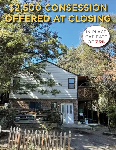 an outdoor space with lots of plants and trees