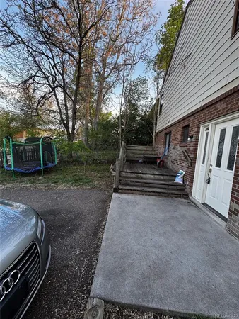 a view of a backyard with trees