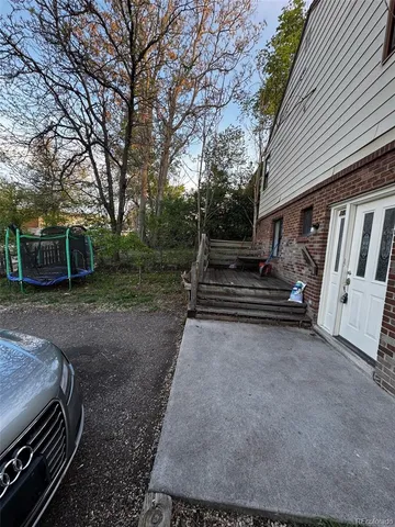 a view of a backyard with trees