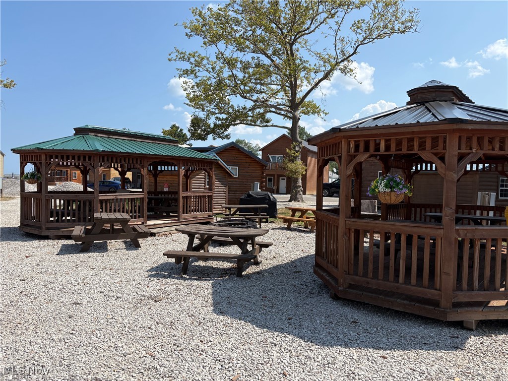 5919 Lake Road West, Unit 15 Ashtabula, OH 44004 - Photo 5 of 26 View of common area featuring a gazebo and a wooden deck