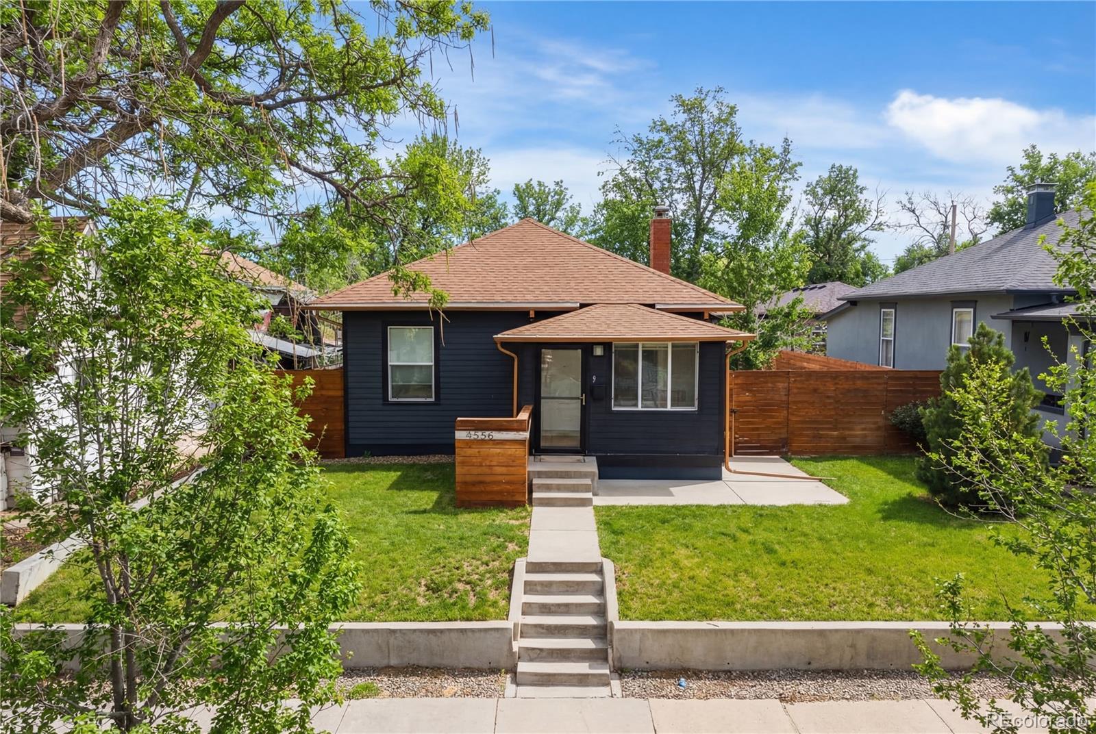 4546 Meade Street Denver, CO 80211 - Photo 2 of 35 a front view of a house with garden