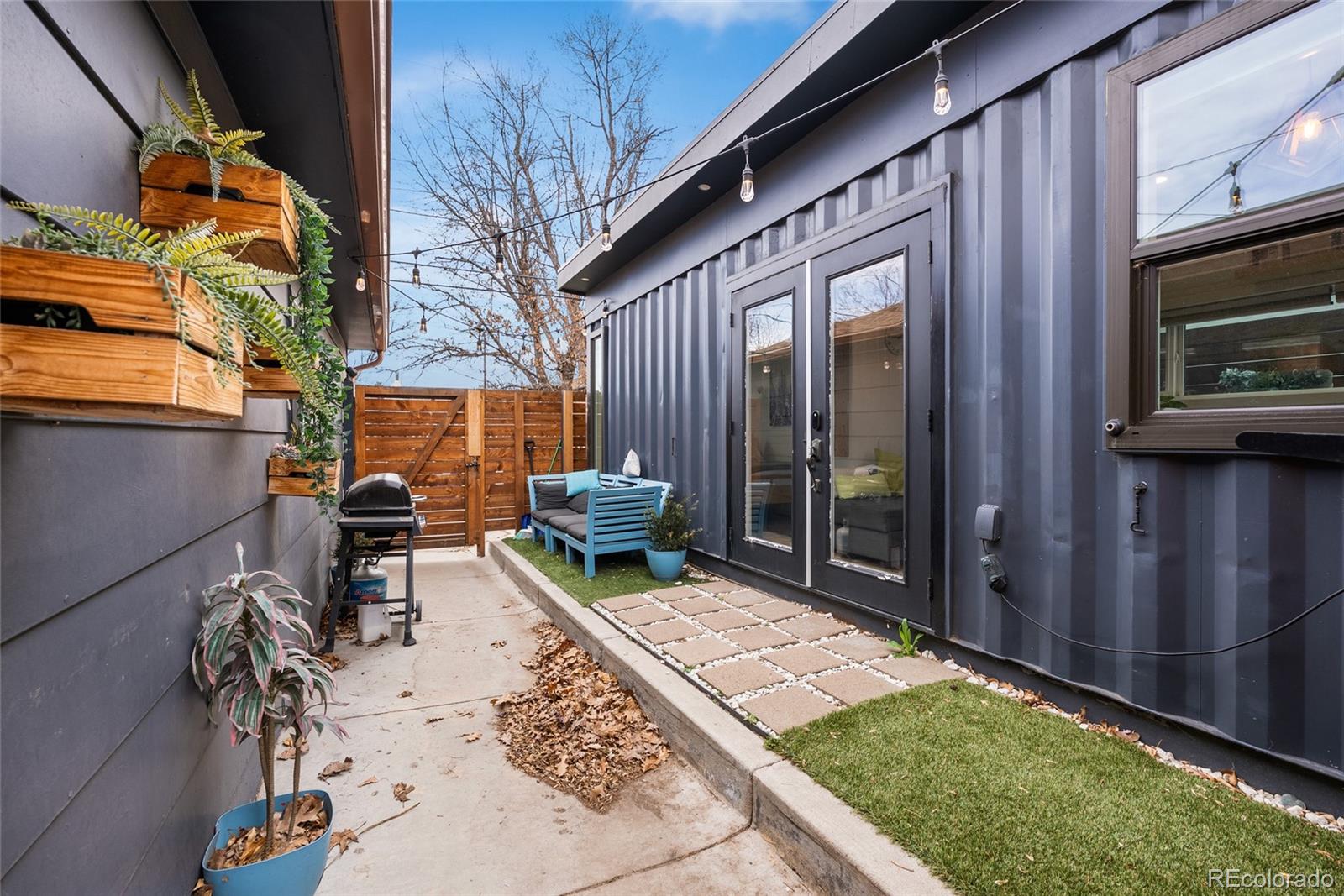 4546 Meade Street Denver, CO 80211 - Photo 21 of 35 a backyard of a house with seating space