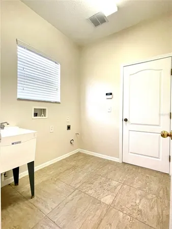 a view of a room with window and cabinet