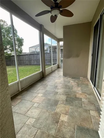 a view of an empty room with a window