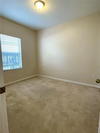 an empty room with a empty space and window