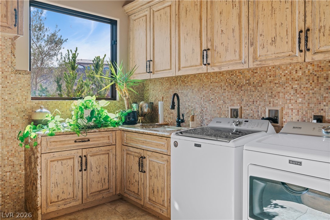 1123 Christian Road Henderson, NV 89002 - Photo 43 of 94 Functional laundry room offers ample storage and a cheerful window view.