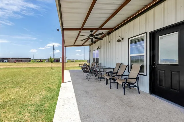 a view of a swimming pool with a table and chairs
