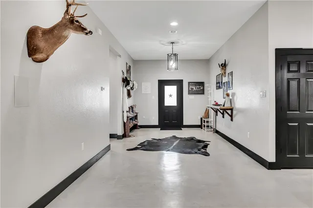 a view of a livingroom with furniture and windows