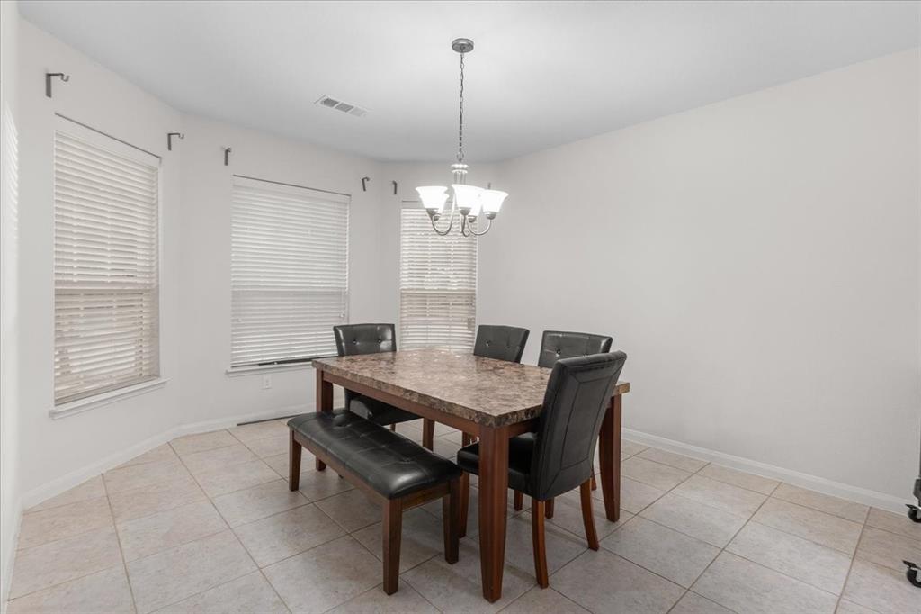 2529 Spring Meadows Drive Denton, TX 76209 - Photo 13 of 29 a dining room with furniture and window