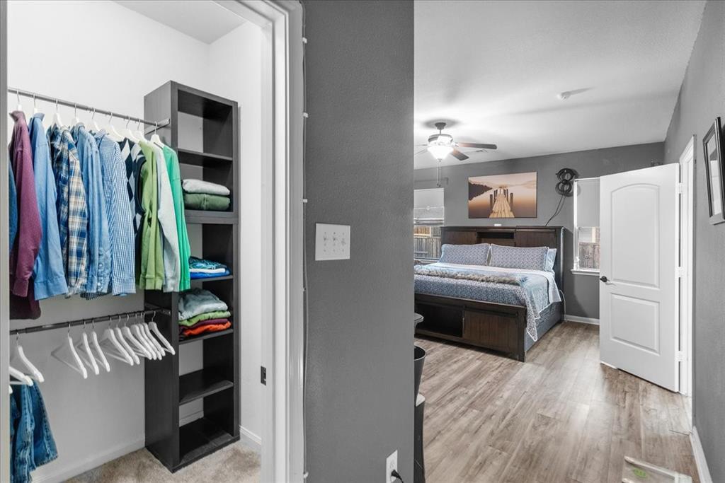 2529 Spring Meadows Drive Denton, TX 76209 - Photo 15 of 29 a kitchen with a refrigerator and a stove top oven