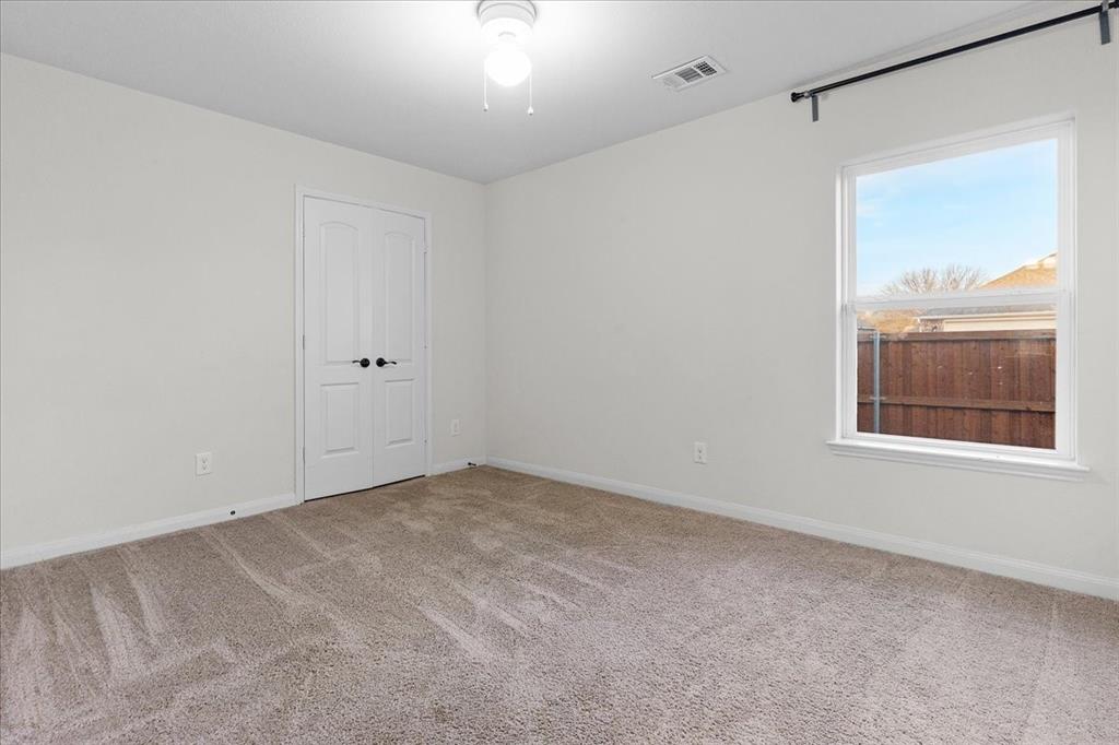 2529 Spring Meadows Drive Denton, TX 76209 - Photo 22 of 29 a view of an empty room with a window
