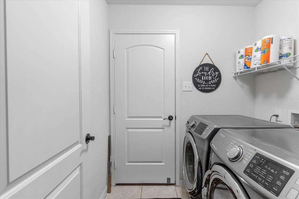2529 Spring Meadows Drive Denton, TX 76209 - Photo 25 of 29 a view of storage and utility room with washer and dryer