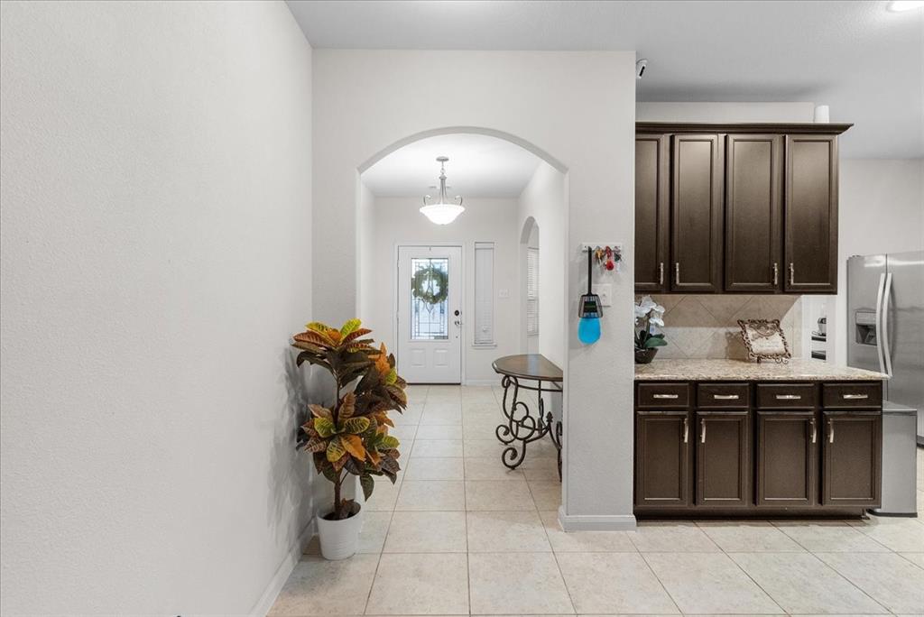 2529 Spring Meadows Drive Denton, TX 76209 - Photo 3 of 29 a kitchen with a sink and cabinets