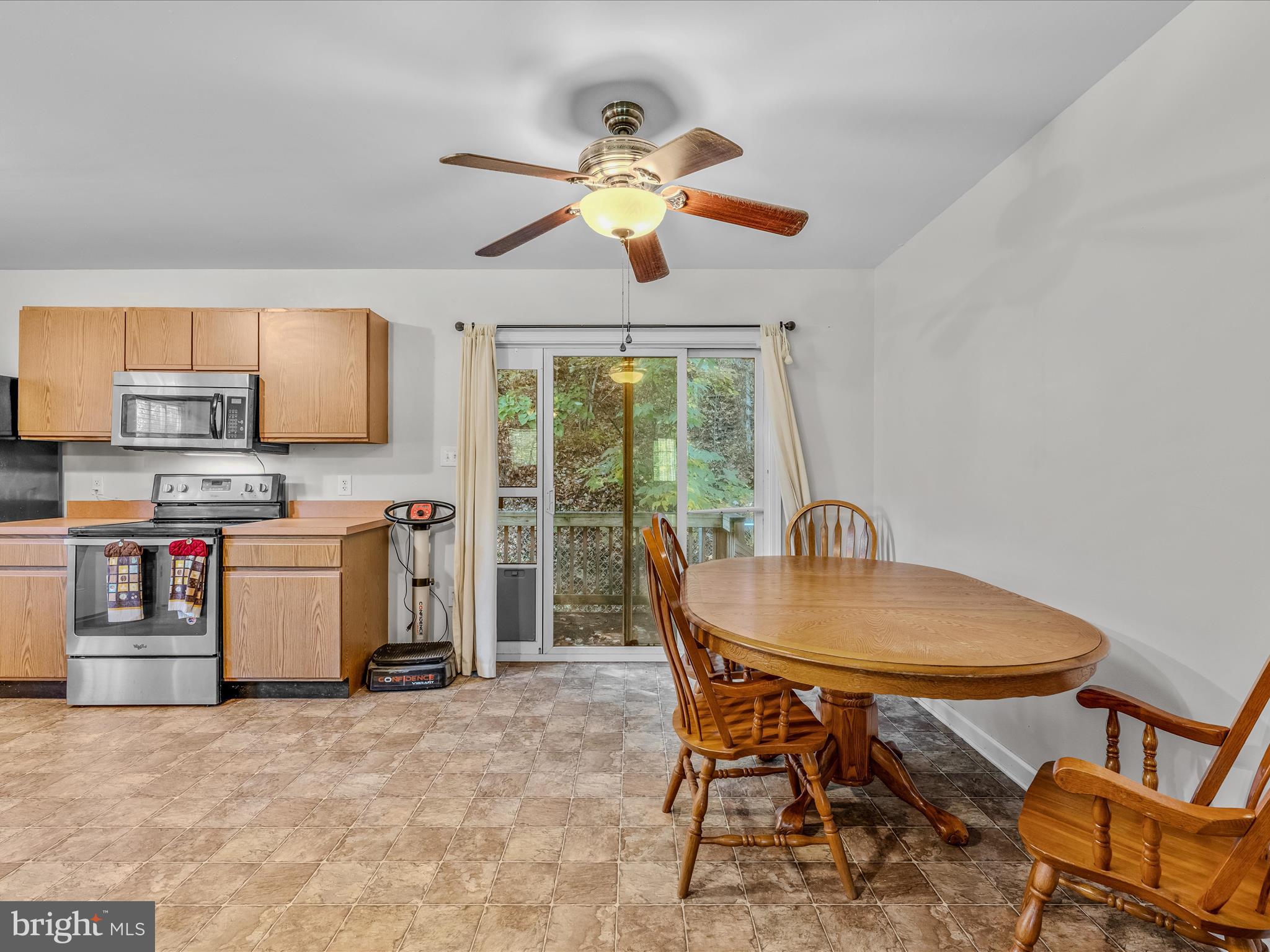 84 New Hope Road Berkeley Springs, WV 25411 - Photo 11 of 28 a view of a dining room with furniture and a window