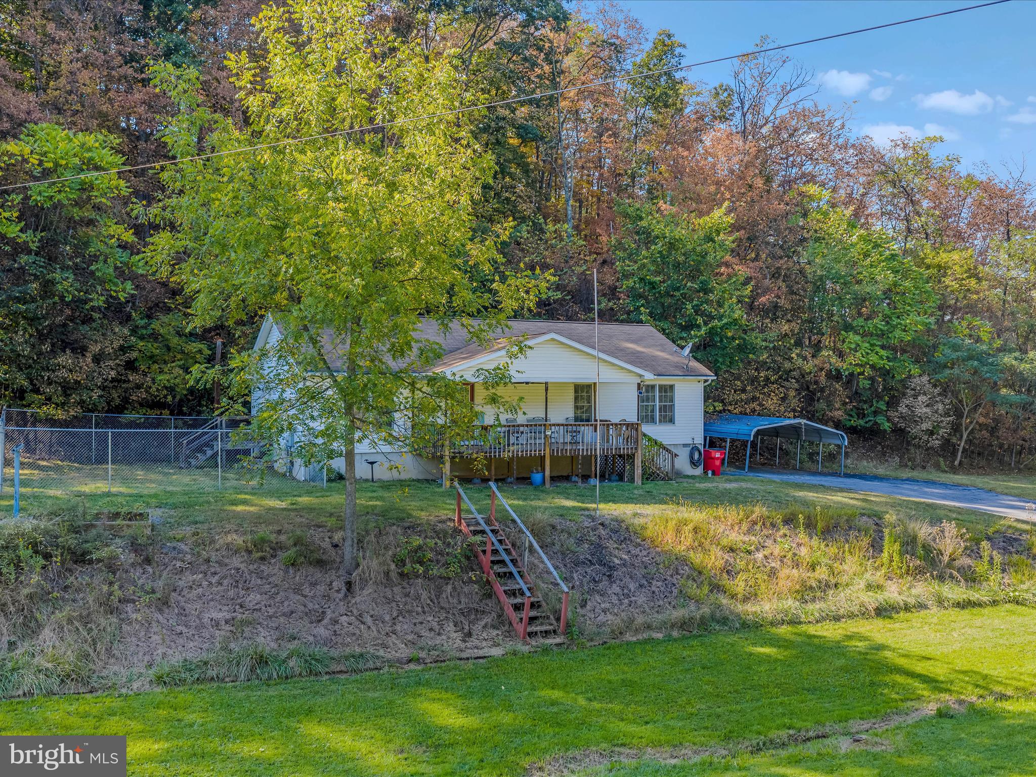 84 New Hope Road Berkeley Springs, WV 25411 - Photo 5 of 28 a view of a house with swimming pool and a yard