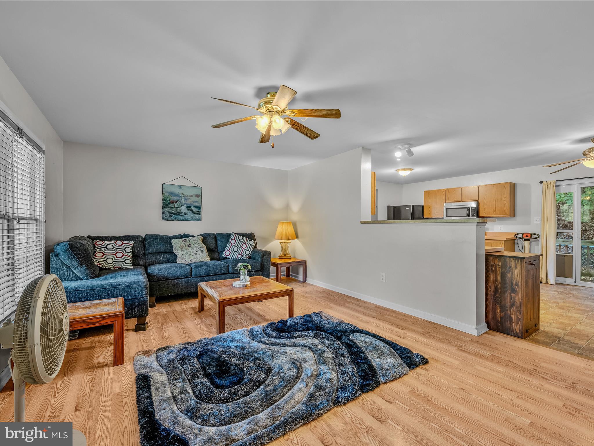 84 New Hope Road Berkeley Springs, WV 25411 - Photo 8 of 28 a living room with furniture and kitchen view