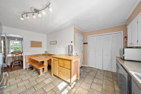 a kitchen with a stove a sink and a refrigerator