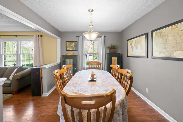 a view of a dining room with furniture window and wooden floor