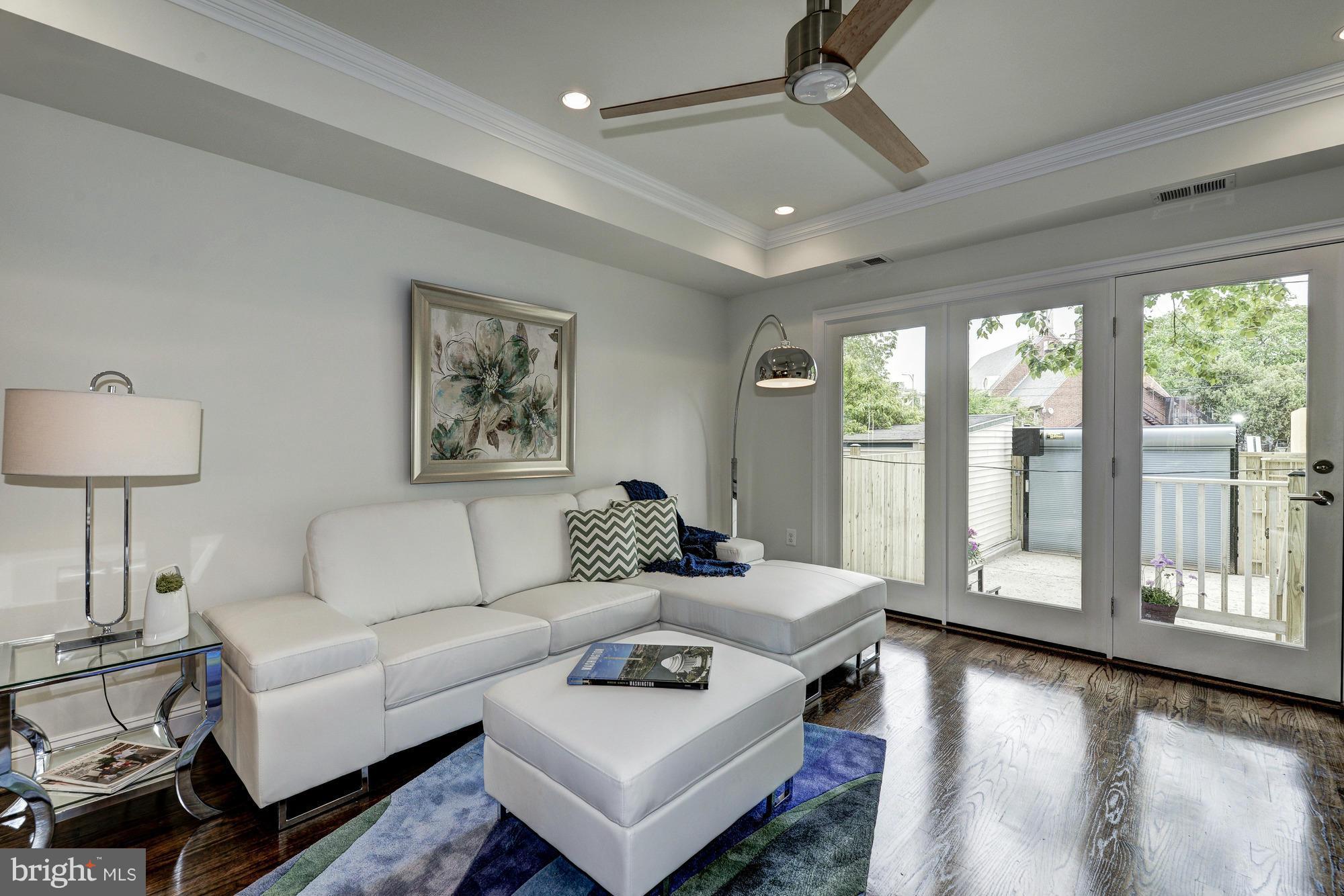 536 14th Street Southeast Washington, DC 20003 - Photo 11 of 25 a living room with furniture and a large window