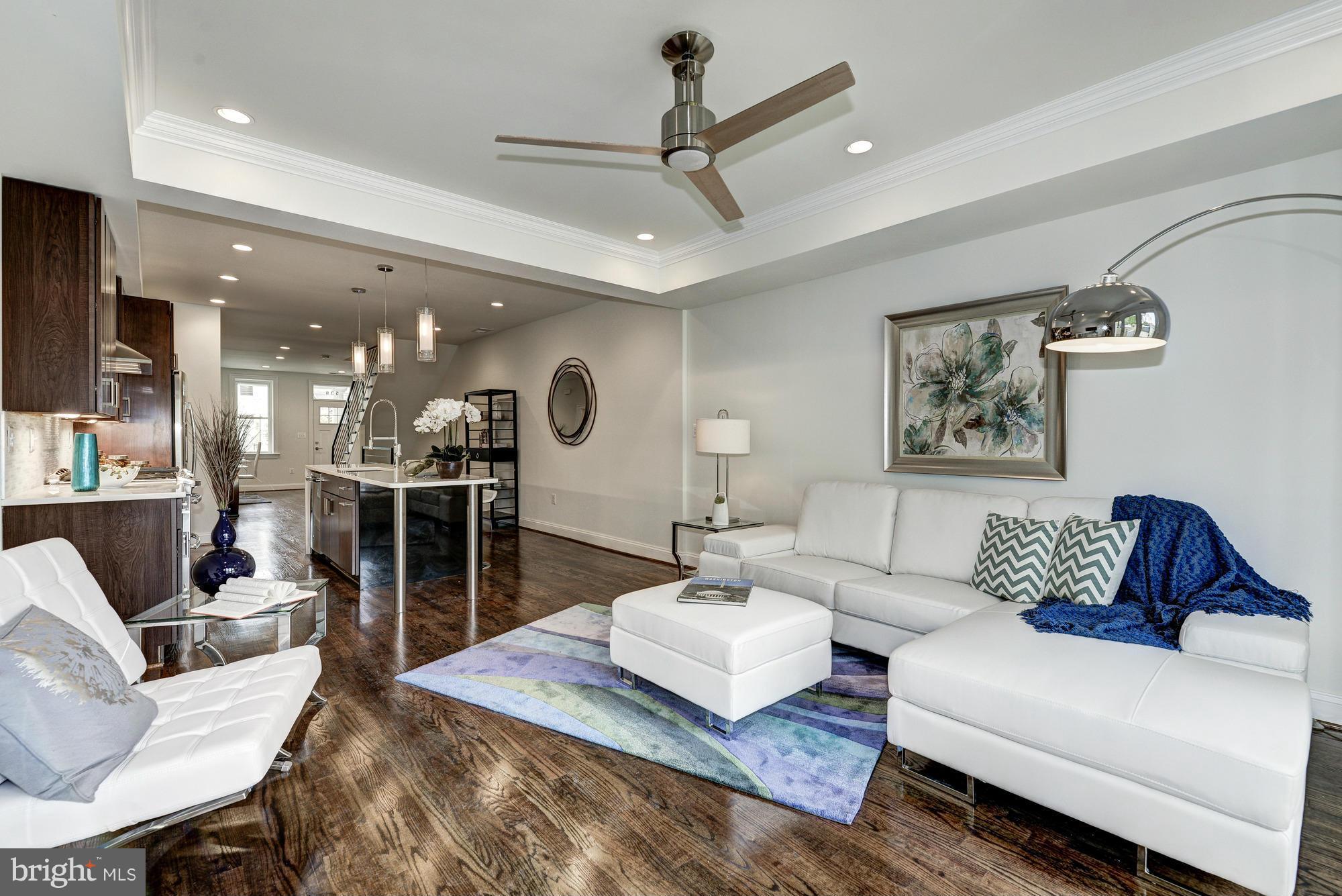 536 14th Street Southeast Washington, DC 20003 - Photo 12 of 25 a living room with furniture kitchen view and a table
