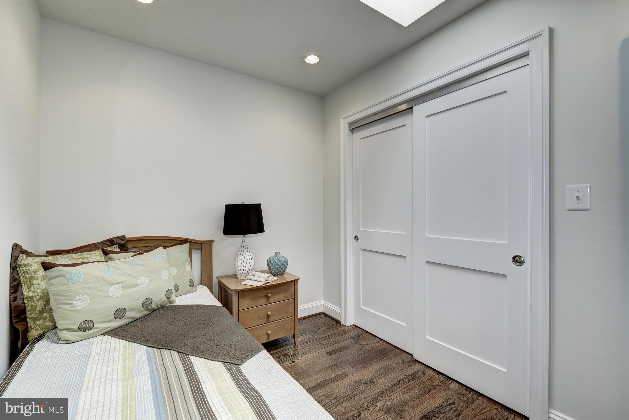 536 14th Street Southeast Washington, DC 20003 - Photo 15 of 25 a bedroom with a bed and a tv