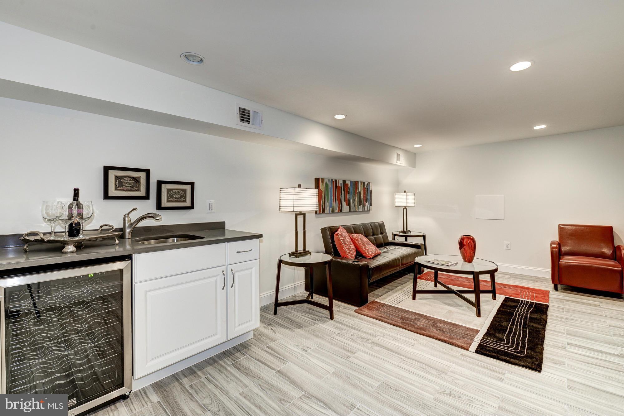 536 14th Street Southeast Washington, DC 20003 - Photo 21 of 25 a living room with furniture and a wooden floor