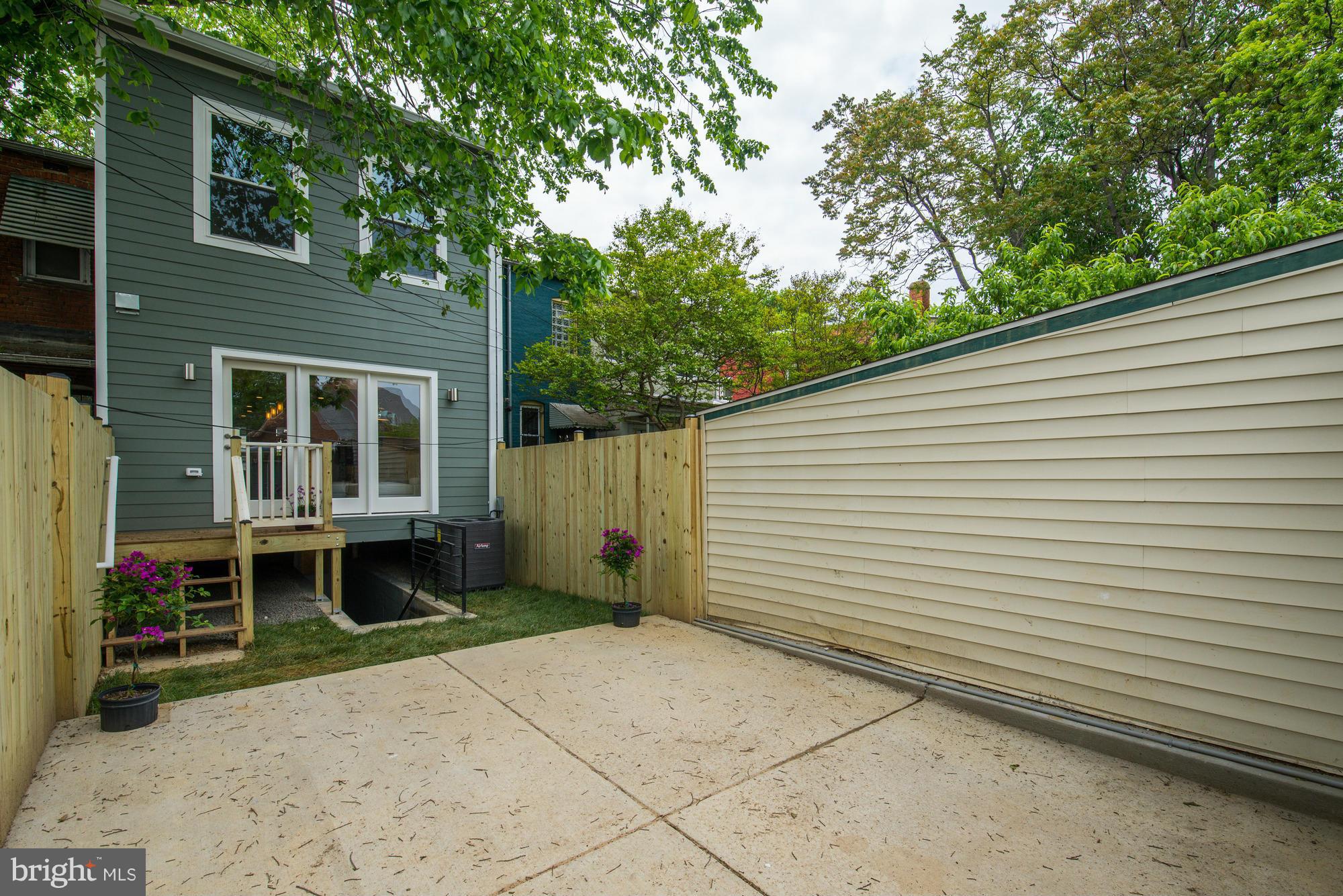 536 14th Street Southeast Washington, DC 20003 - Photo 25 of 25 a backyard of a house with outdoor seating