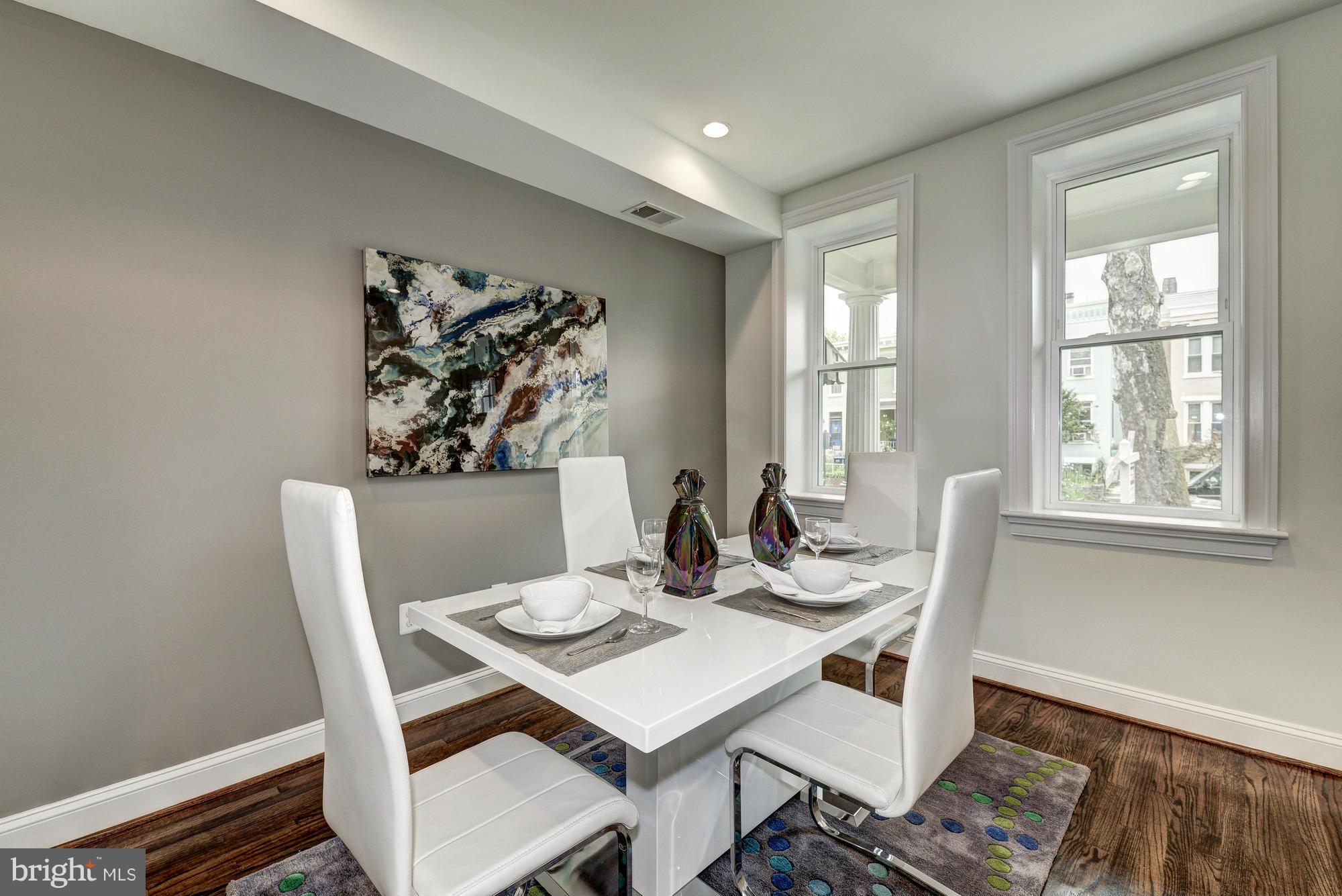 536 14th Street Southeast Washington, DC 20003 - Photo 4 of 25 a view of a dining room with furniture window and wooden floor