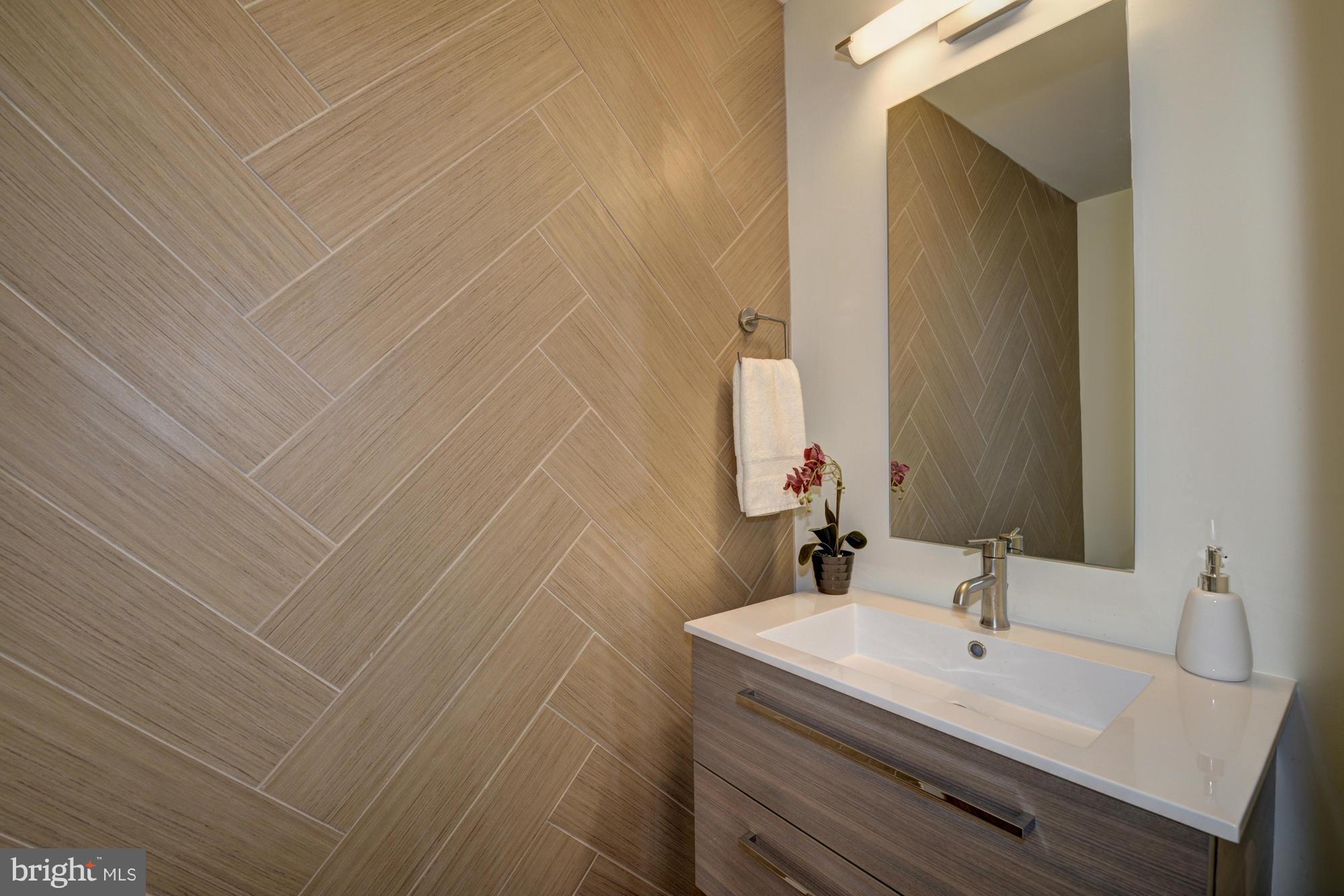 536 14th Street Southeast Washington, DC 20003 - Photo 8 of 25 a bathroom with a sink and a mirror