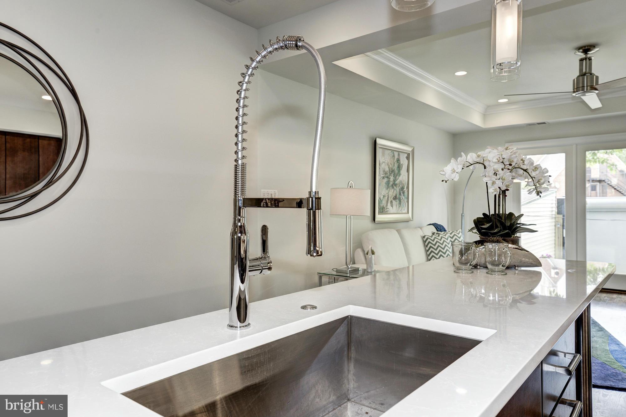 536 14th Street Southeast Washington, DC 20003 - Photo 9 of 25 a kitchen with a sink and a mirror