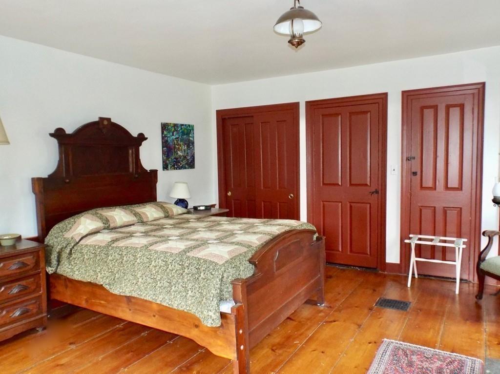 2 Charlemont Road Buckland, MA 01338 - Photo 24 of 42 a bedroom with a bed and a chair