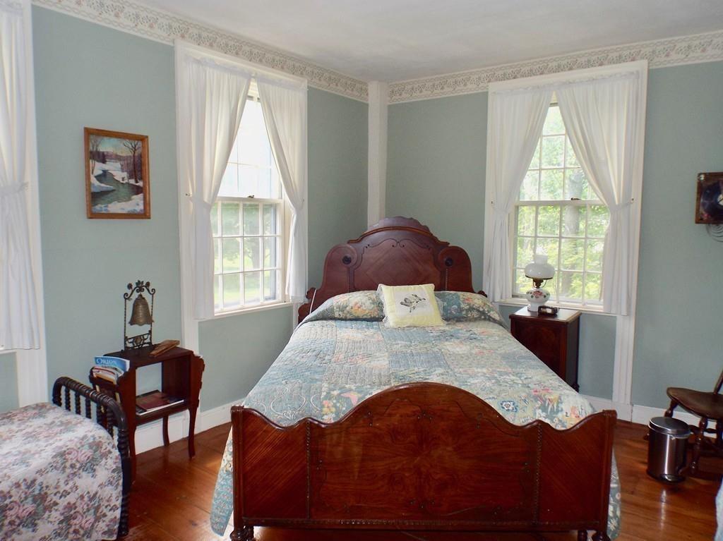 2 Charlemont Road Buckland, MA 01338 - Photo 25 of 42 a bedroom with a bed and wooden floor