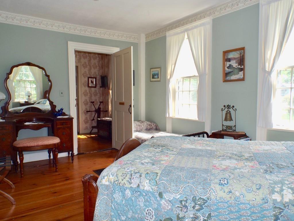 2 Charlemont Road Buckland, MA 01338 - Photo 28 of 42 a bedroom with a bed and wooden floor