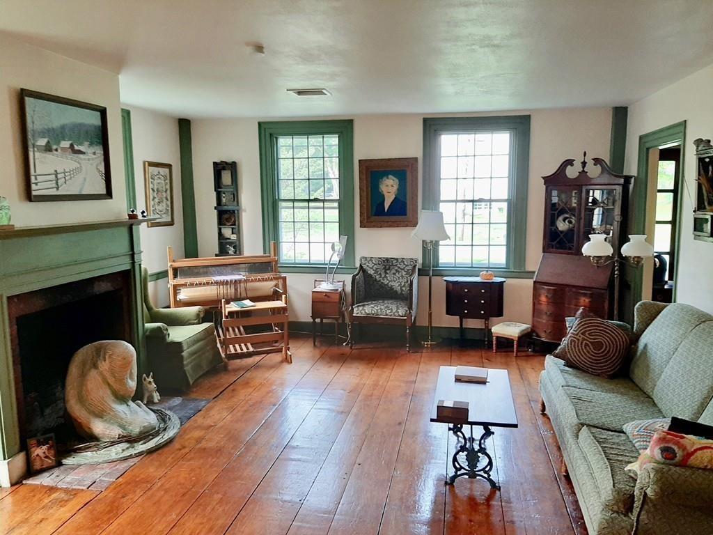 2 Charlemont Road Buckland, MA 01338 - Photo 7 of 42 a living room with furniture a fireplace and a large window