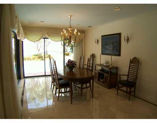 63 North River Road Stuart, FL 34996 - Photo 2 of 8 a view of a dining room with furniture and chandelier