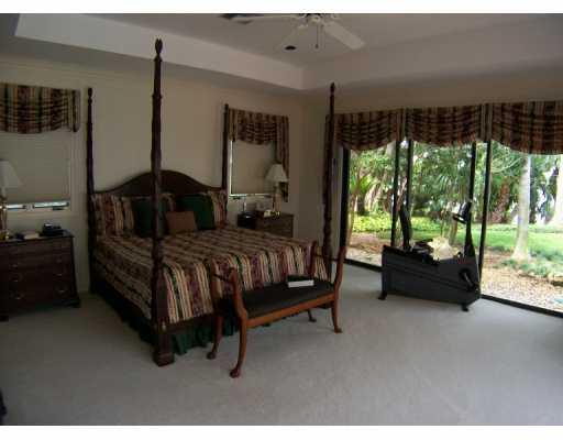 63 North River Road Stuart, FL 34996 - Photo 4 of 8 a bedroom with furniture and a large window
