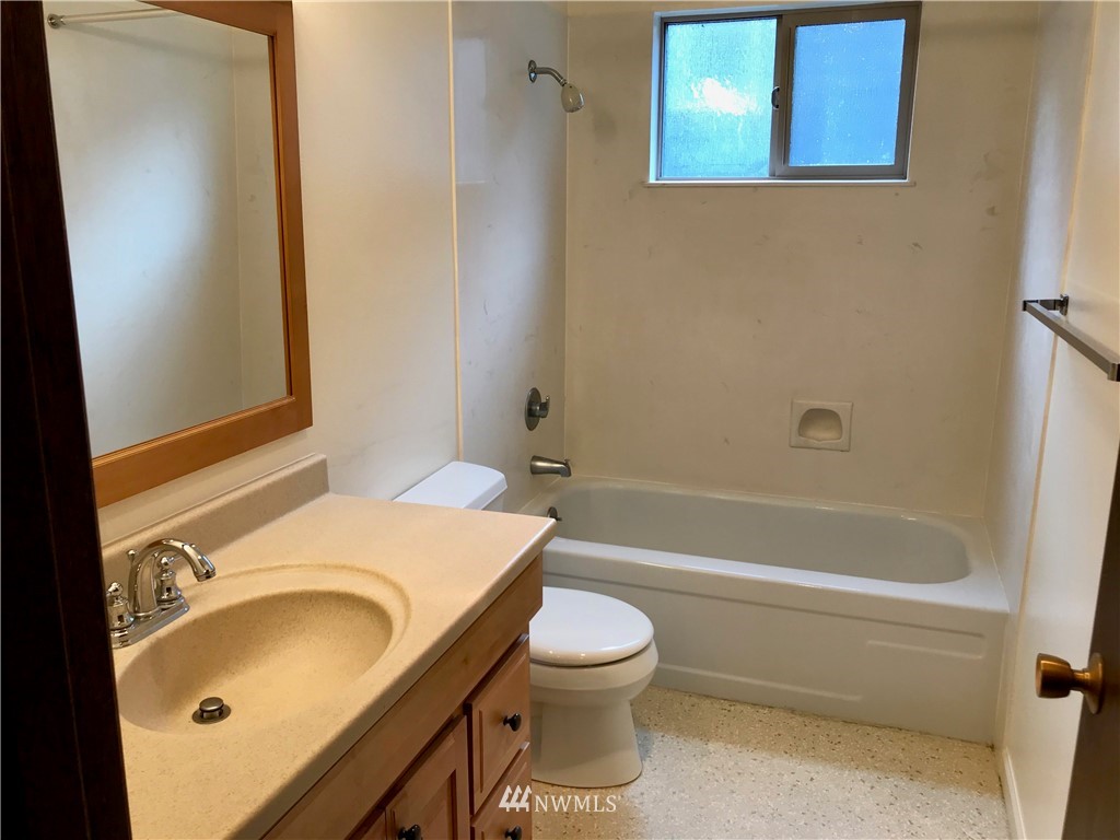 3912 Linden Avenue North Seattle, WA 98103 - Photo 11 of 11 a bathroom with a sink toilet and shower