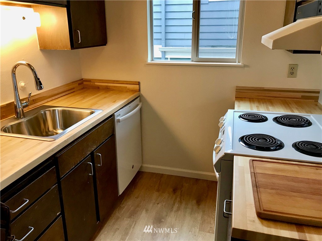 3912 Linden Avenue North Seattle, WA 98103 - Photo 8 of 11 a kitchen with a stove and a sink