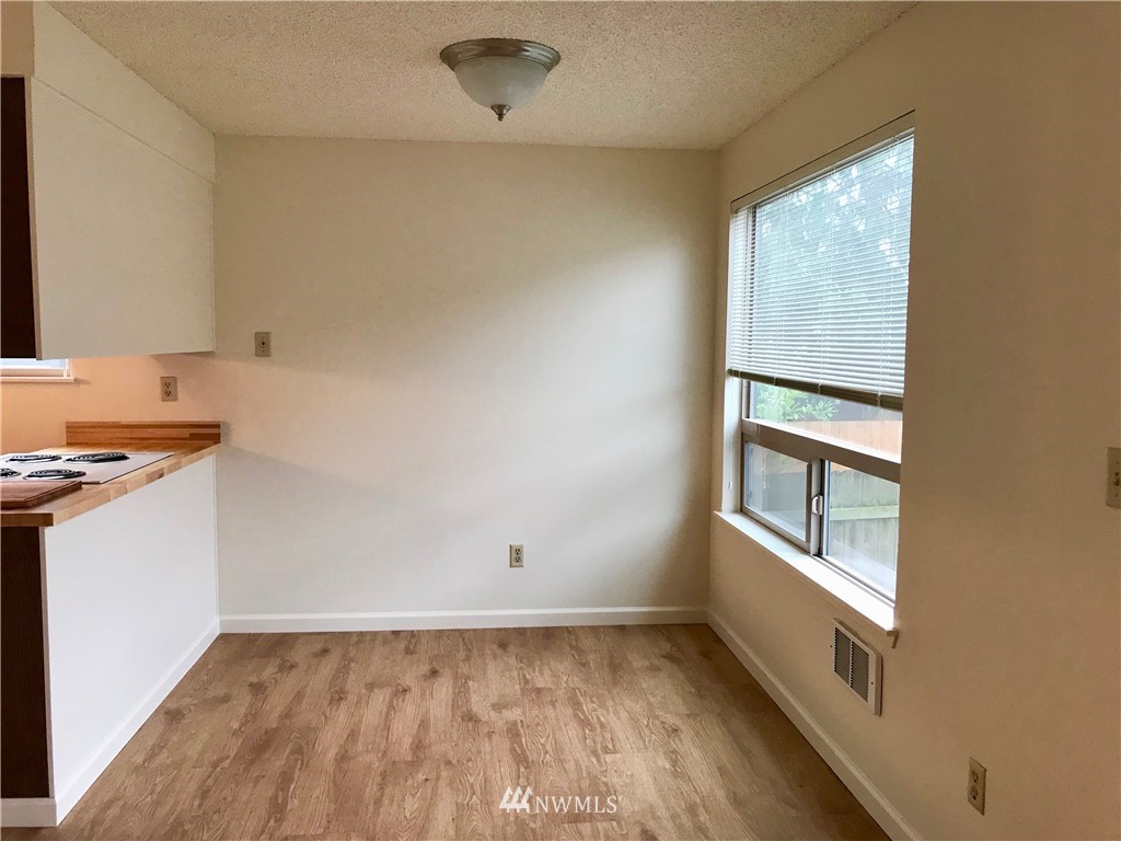 3912 Linden Avenue North Seattle, WA 98103 - Photo 9 of 11 an empty room with a window